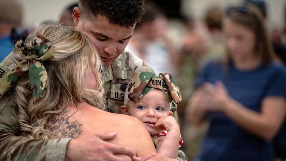An Oklahoma Army National Guard Soldier hugs his family during the unit’s welcome home ceremony in Mustang, Oklahoma, Aug. 20, 2026. Resources for reintegration to service or transition are among the many tools available to service members, veterans, families, and caregivers through the National Resource Directory. The federal website connects to thousands of vetted services and programs at the national, state, and local levels, supporting recovery, rehabilitation, reintegration and transition. (Photo by: Oklahoma National Guard Staff Sgt. Anthony Jones) 