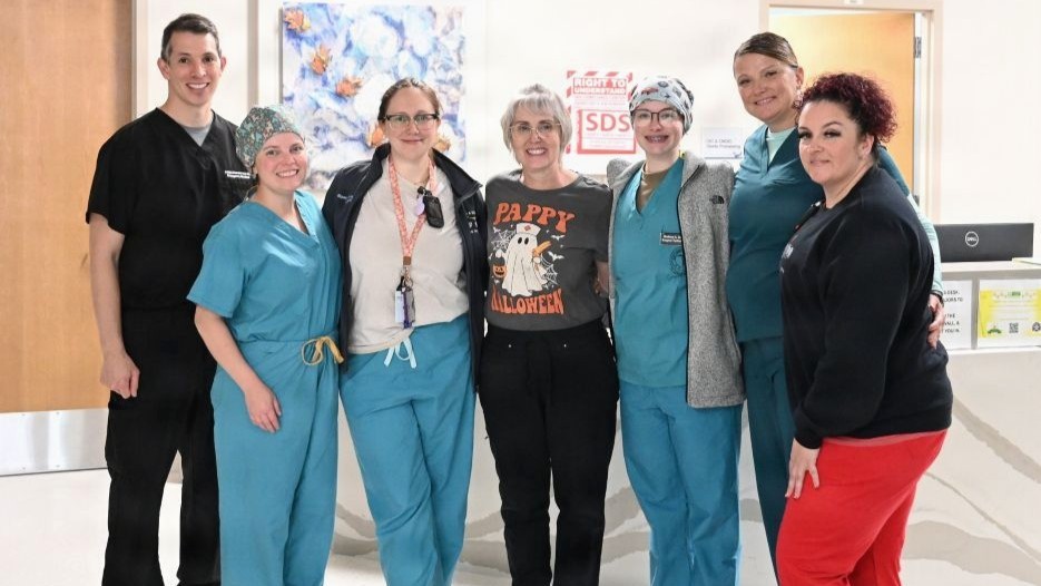 Photo By Debra Thompson | Members of the multidisciplinary clinical delivery team gather at General Leonard Wood Community Hospital following the facility’s historic first delivery of triplets late Wednesday night. Pictured from left to right: Maj. Adam Henderson, Alyssa Skomp, Maj. Alyssa Provagna, Terina Knarr, Stephanie Bancroft, and Twana Randall. The interprofessional team of military and civilian healthcare professionals mobilized in under 30 minutes to perform an emergency cesarean section and stabilize three premature infants, underscoring the Defense Health Agency’s commitment to clinical currency and ready, reliable care for military families.