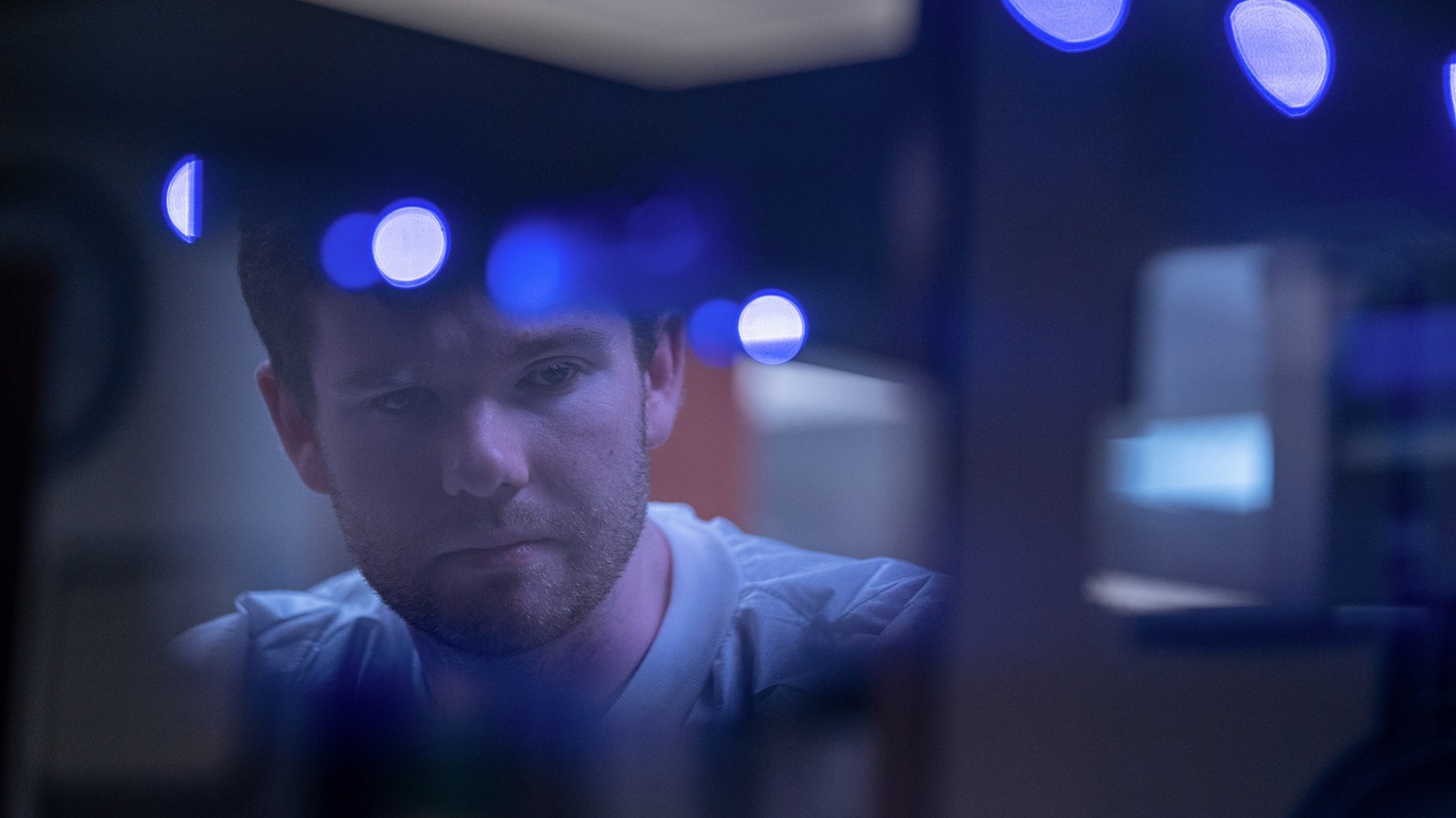 David Schranko, 359th Diagnostics and Therapeutics Squadron molecular genetics technologist, monitors a liquid handling machine on Keesler Air Force Base, Mississippi, Oct. 29, 2025. Schranko extracted cell-free DNA from blood samples to prepare it for a non-invasive pregnancy test. (U.S. Air Force photo by Senior Airman Devyn Waits).
