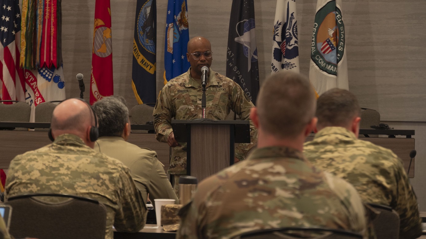 Col. Owen Roberts speaks to a group