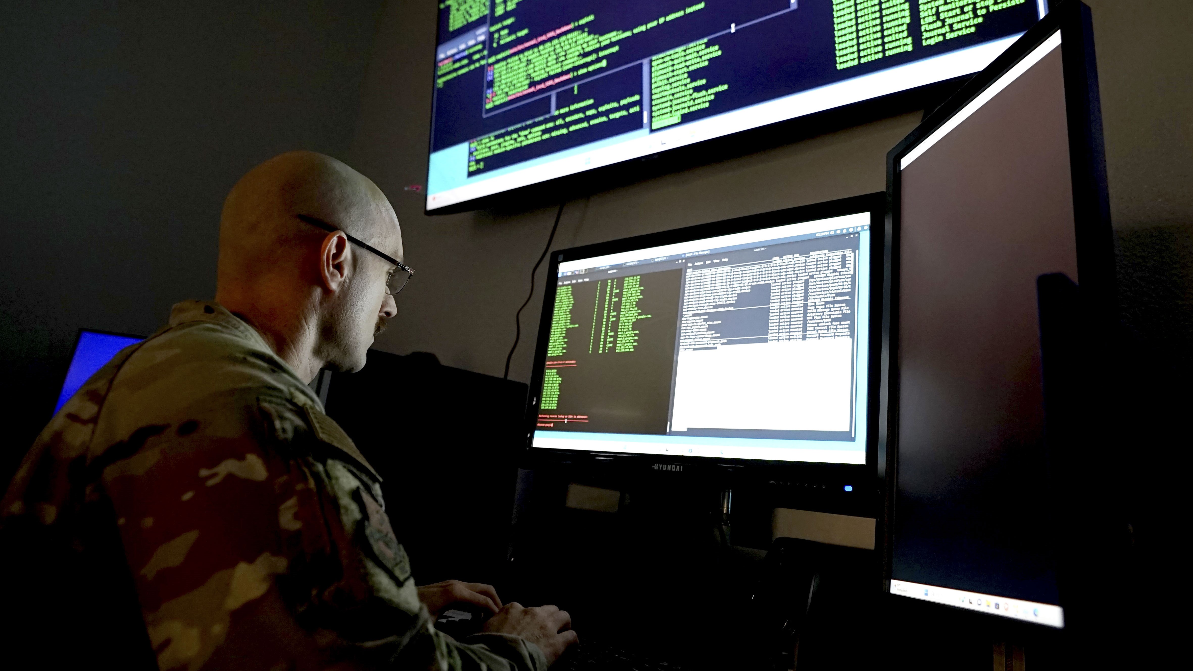 service member at computer terminal