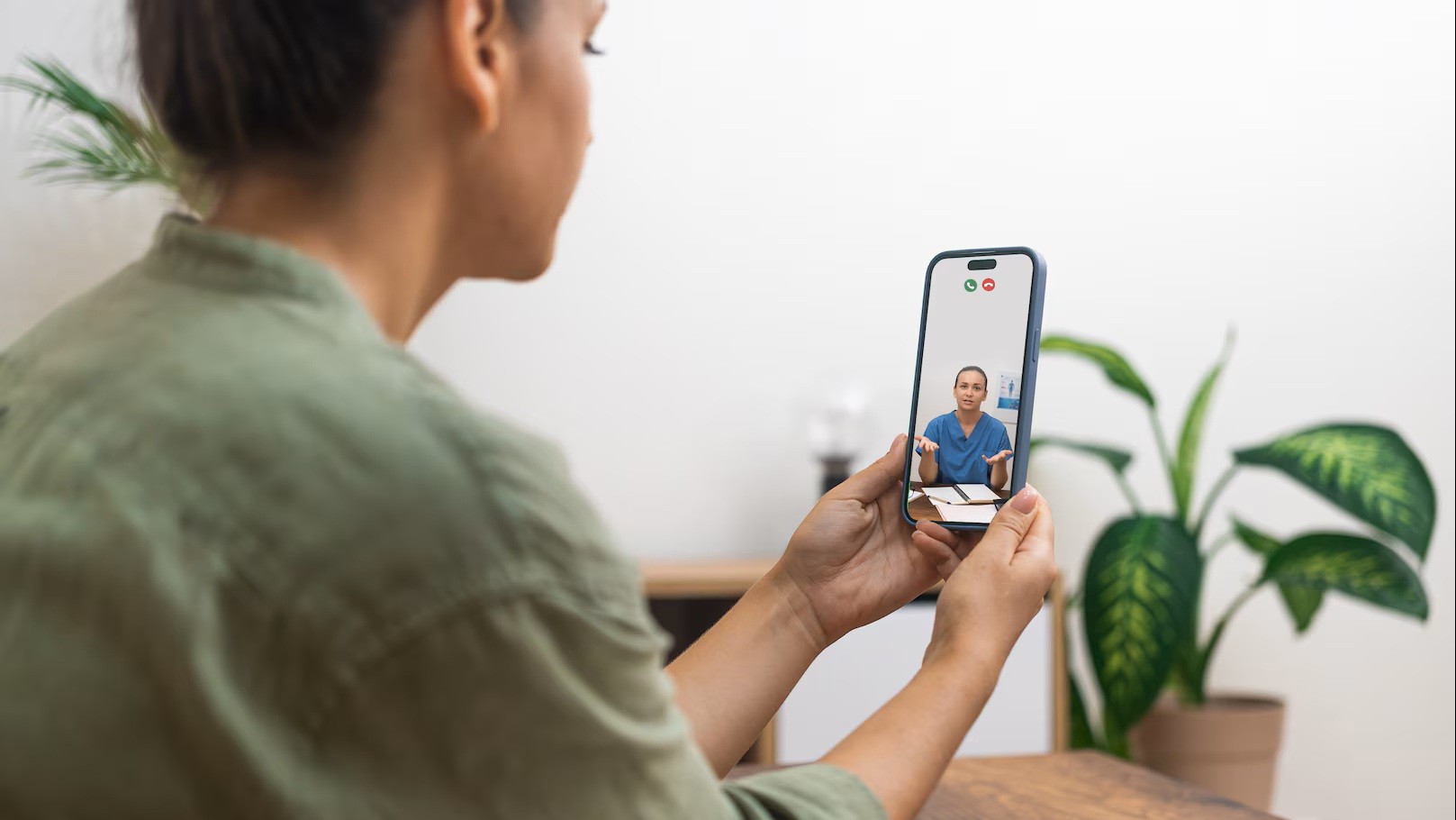 Woman conversing with her provider on her smartphone