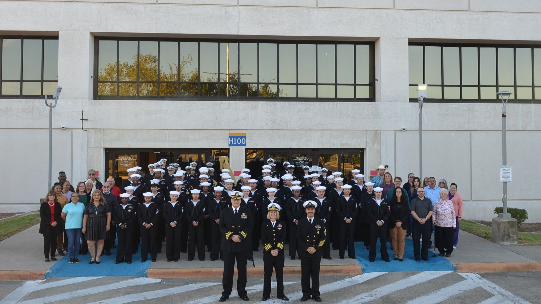 Staff gathered in front of the facility